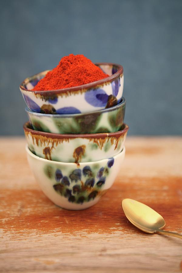 Saffron Powder In A Stack Of Ceramic Bowls Photograph by Viola Cajo