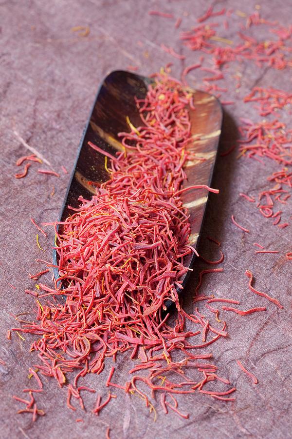Saffron Threads In A Wooden Bowl Photograph by Hilde Mche