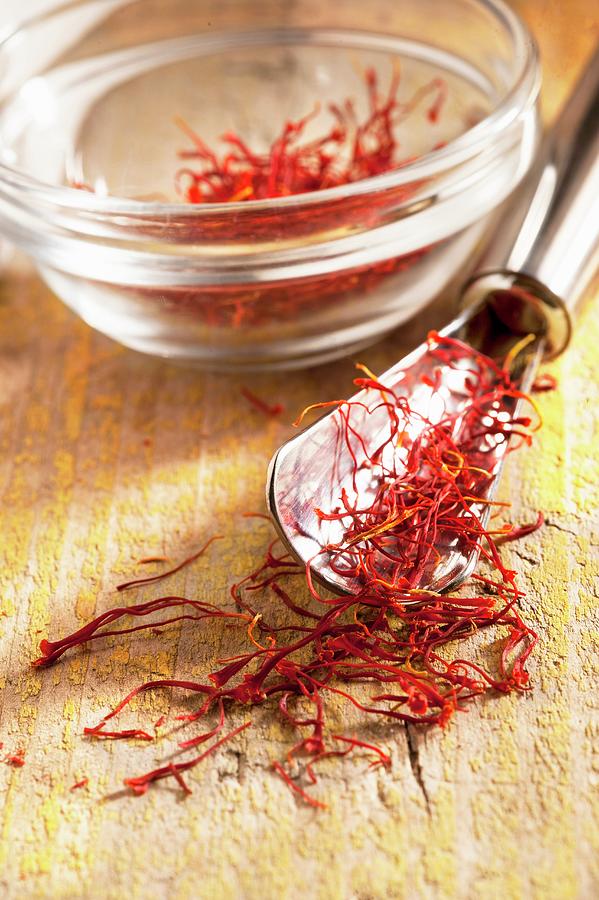 Saffron Threads On A Spoon And In A Glass Bowl Photograph by Piga & Catalano S.n.c.