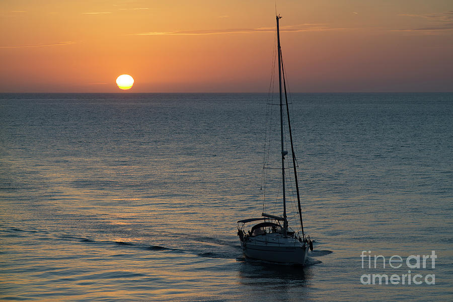 Sailboat Heading Home at Sunset Cadiz Spain Photograph by Pablo Avanzini