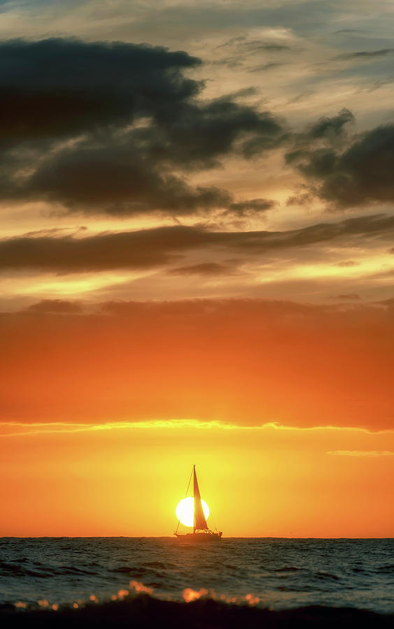 Sailboat In Front of a Hawaiian Sunset Photograph by Christopher Johnson