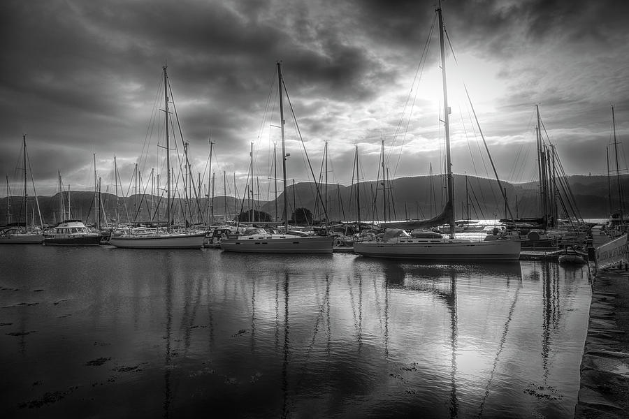 Sailboat Reflections at Sunrise Black and White Photograph by Debra and Dave Vanderlaan