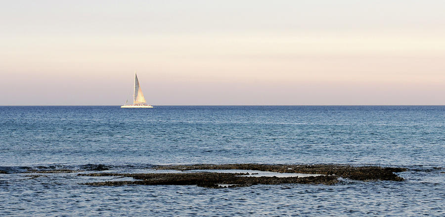 Sailing boat in the Calm Ocean Photograph by Michalakis Ppalis