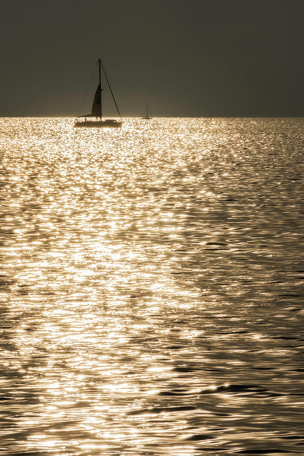 Sailing into a Croatian sunset Photograph by Wolfgang Stocker