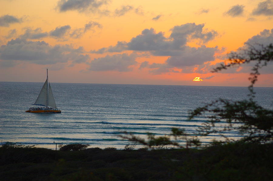 Sailing Into An Aruba Sunset Photograph by Dennis Schmidt