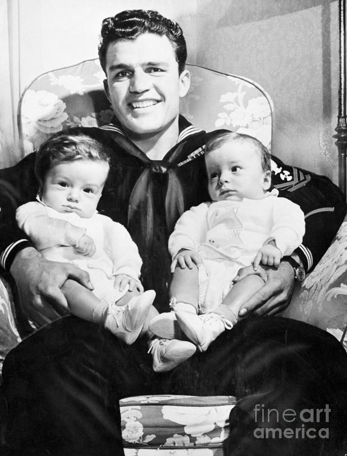Sailor Holding His Two Sons Photograph by Bettmann