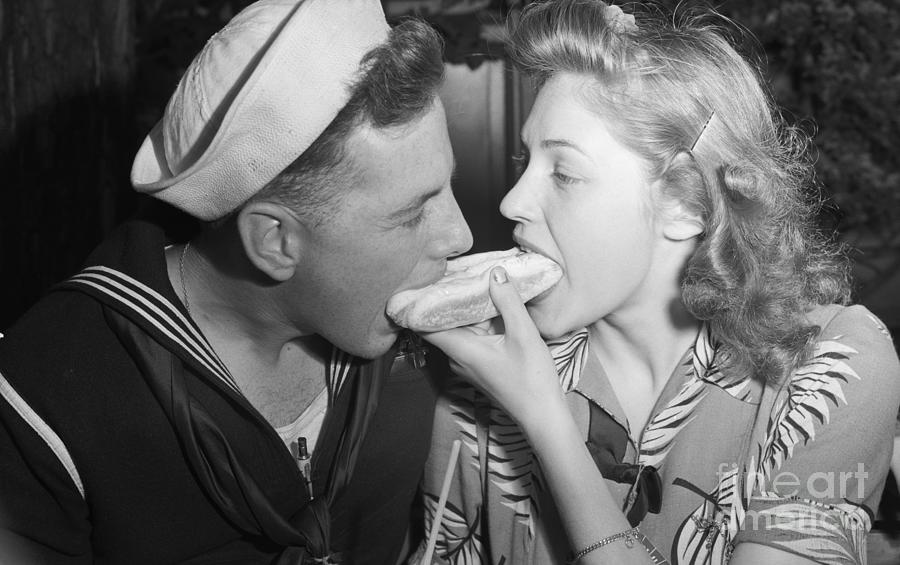 Sailor Sharing A Hotdog Photograph by Bettmann