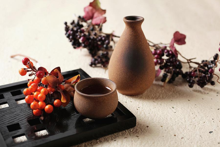 Sake In A Bowl And A Carafe Decorated With Berries Photograph by Yuichi Nishihata Photography