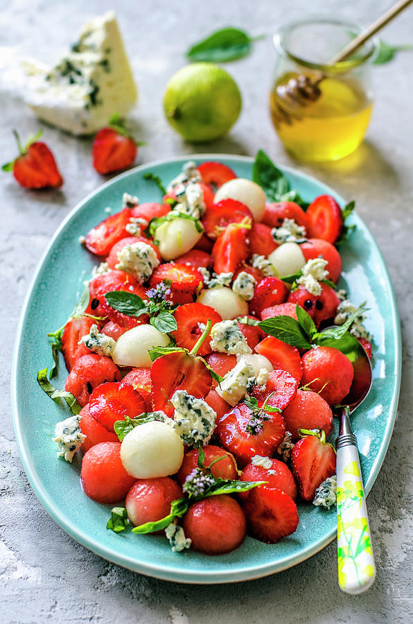 Salad From Watermelon, Melon, Strawberry, Basil And Blue Cheese With Honey Photograph by Gorobina