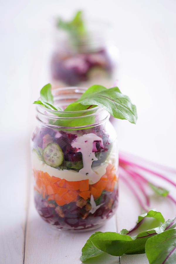 Salad Ingredients Layered In A Jar beetroot, Carrot, Mayonnaise, Cucumber And Chard Photograph by Studio Lipov