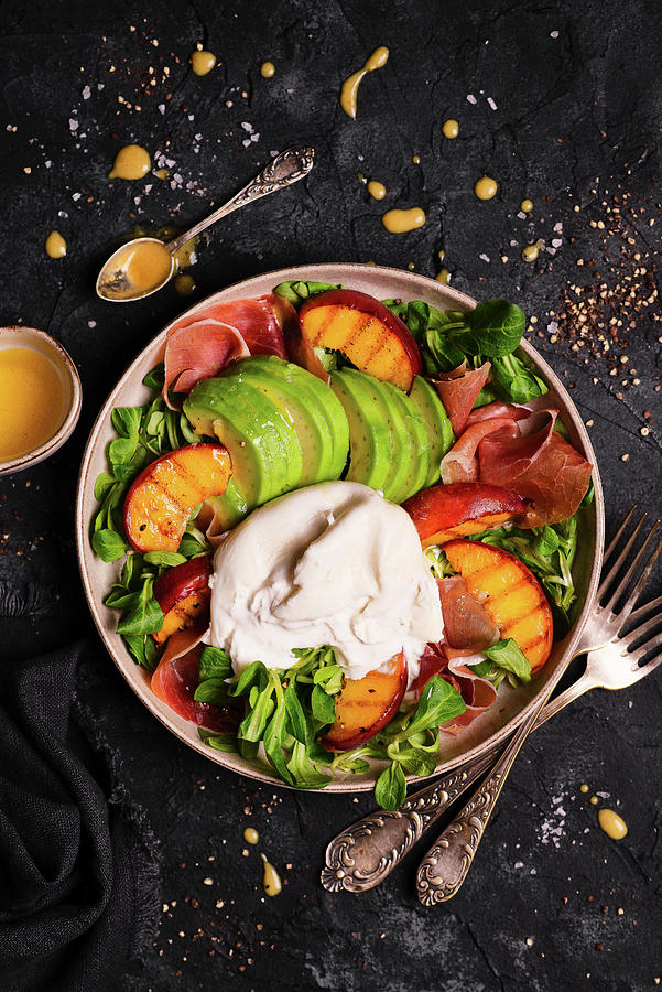 Salad With Arugula, Peaches, Avocado, Burrata And Parma Ham Photograph by Karolina Polkowska