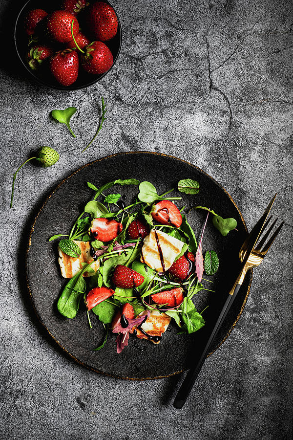 Salad With Halloumi Strawberries Arugula Radish Leaves And Balsamic Sauce Photograph by Karolina Nicpon
