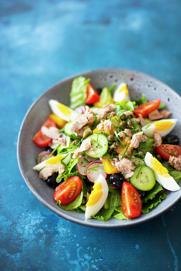 Salade Nioise salad With Tuna, Capers And Anchovy Fillets Photograph by Jan Wischnewski