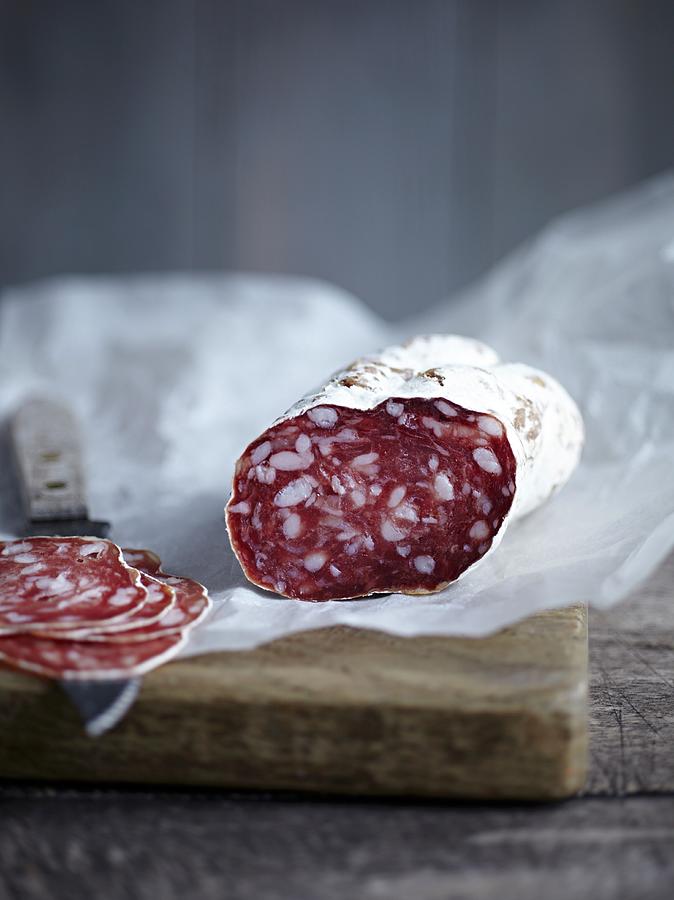 Salami, Sliced, On A Piece Of Paper Photograph by Marc O. Finley