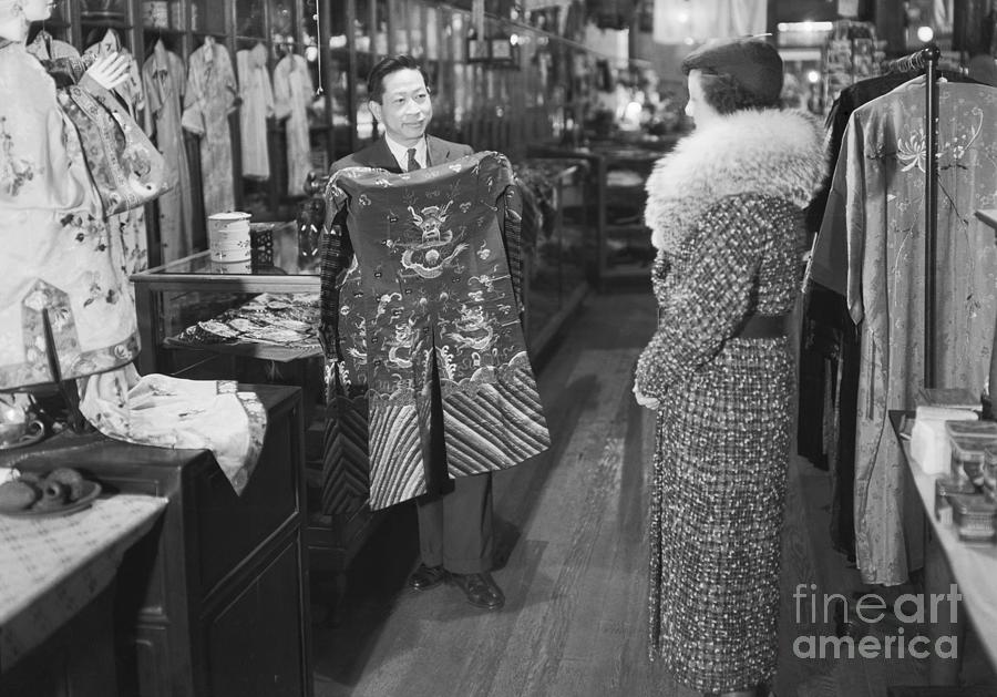 Salesman Selling Robe Photograph by Bettmann
