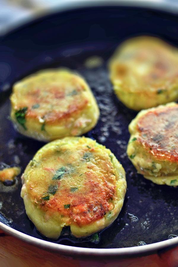 Salmon Cakes In A Pan Photograph by Roger Stowell