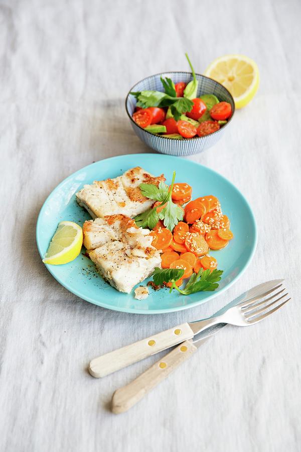 Salmon Fillet With Carrots And A Tomato And Avocado Salad Photograph by Claudia Timmann