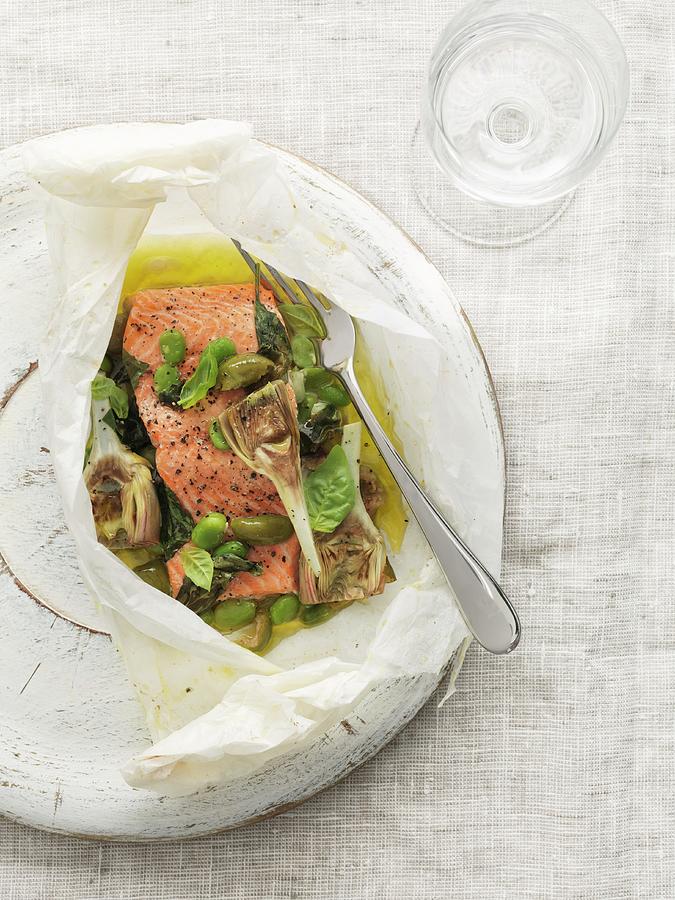 Salmon Fillets With Artichokes And Olives In Parchment Paper Photograph by Jonathan Gregson