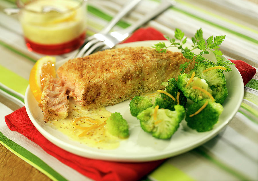 Salmon In Almond Crust With Brocolis And Orange-flavored Cream Sauce Photograph by Bertram