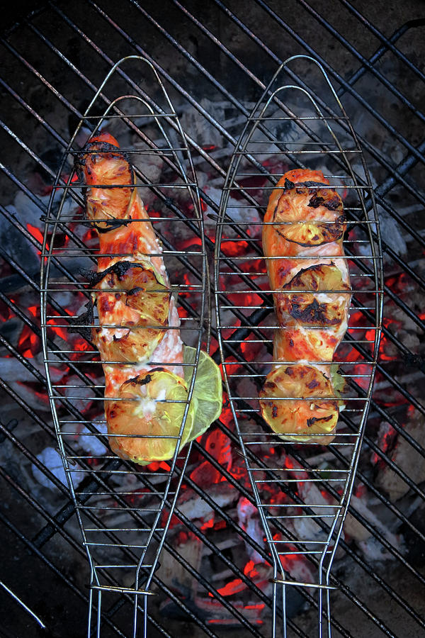 Salmon Steaks In Fish Grills Over A Fire top View Photograph by Petr Gross