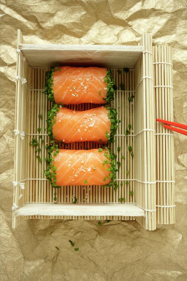 Salmon Sushi In A Basket Made From Bamboo Mats Photograph by Michael Wissing
