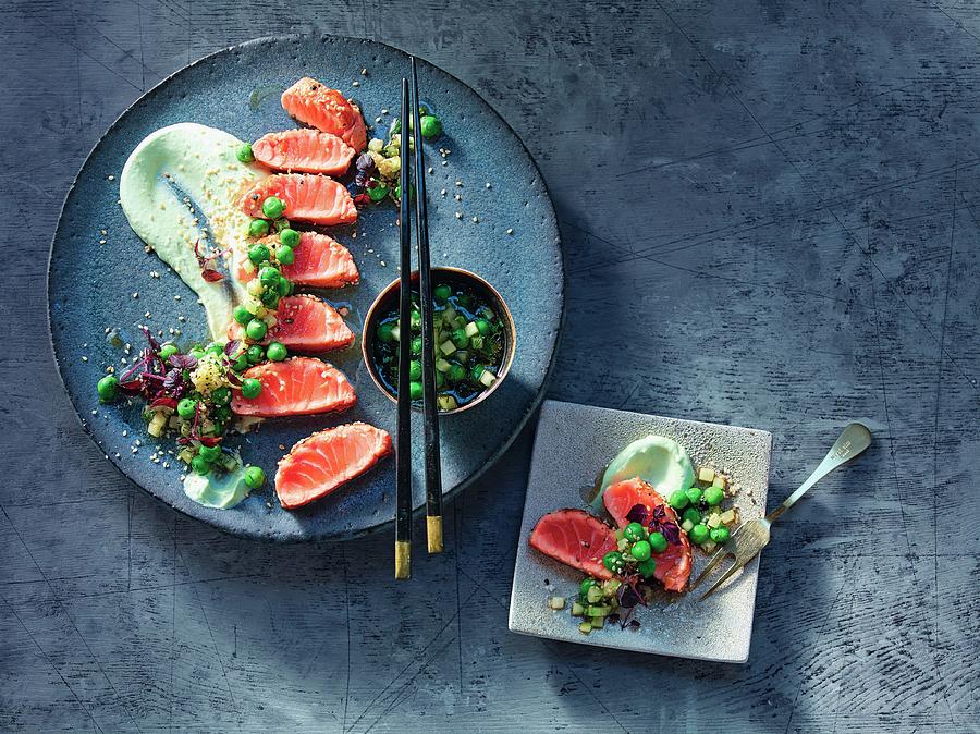 Salmon Tataki Coated In Sesame Seeds On Wasabi And Lime Crme Frache And Pea And Cucumber Salad Photograph by Jalag / Jan-peter Westermann