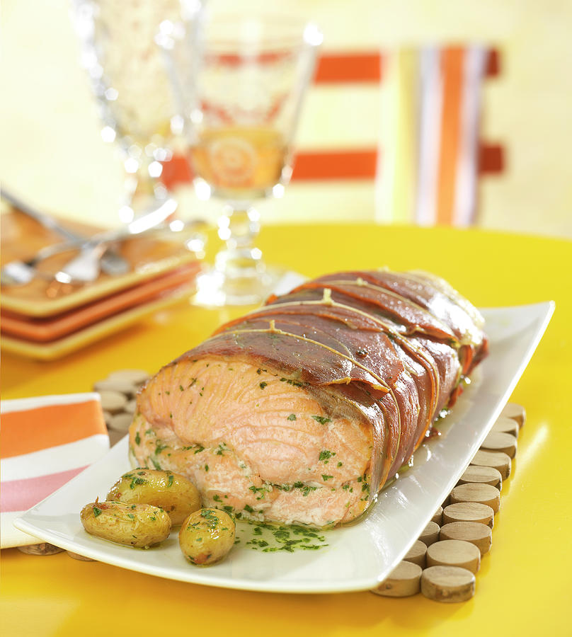 Salmon Wrapped In Bacon With Parsley Butter And Sauteed Potatoes Photograph by Bertram