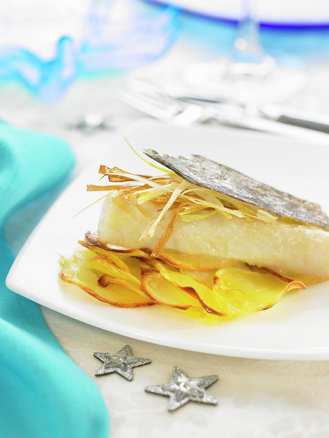 Salt-cod Fillet With Cava, Thinly Sliced Leeks And Sauteed Potatoes Photograph by Lawton
