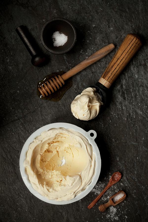 Salted Honey Ice Cream In A Tub And Scoop Photograph by Jane Saunders
