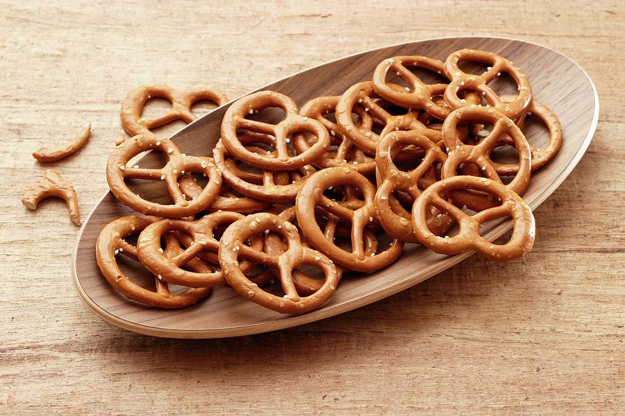 Salted Pretzels In A Wooden Dish Photograph by Petr Gross
