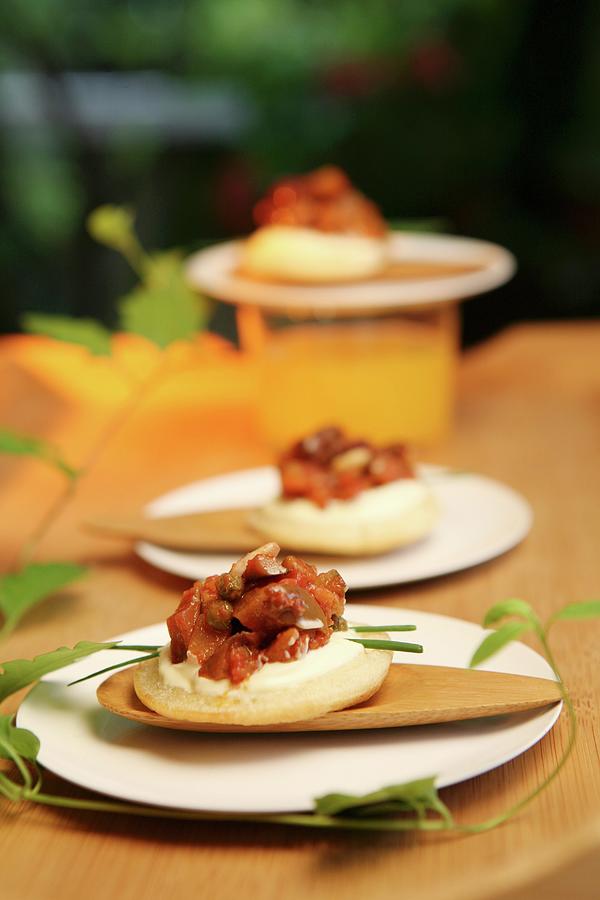 Salty Crackers With Cambozola, Tomatoes, Olives, Capers And Chives Photograph by Viola Cajo