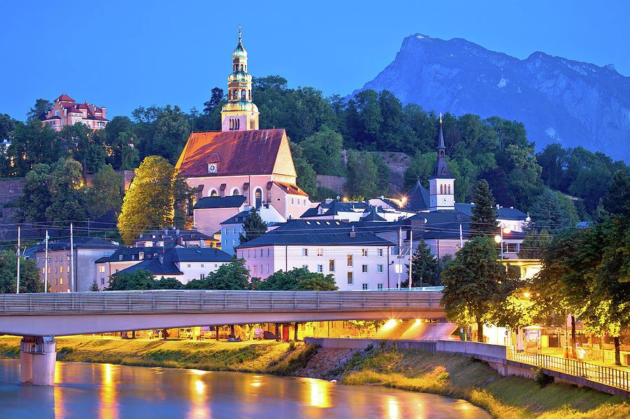 Salzburg historic architecture and mountain peaks background eve Photograph by Brch Photography