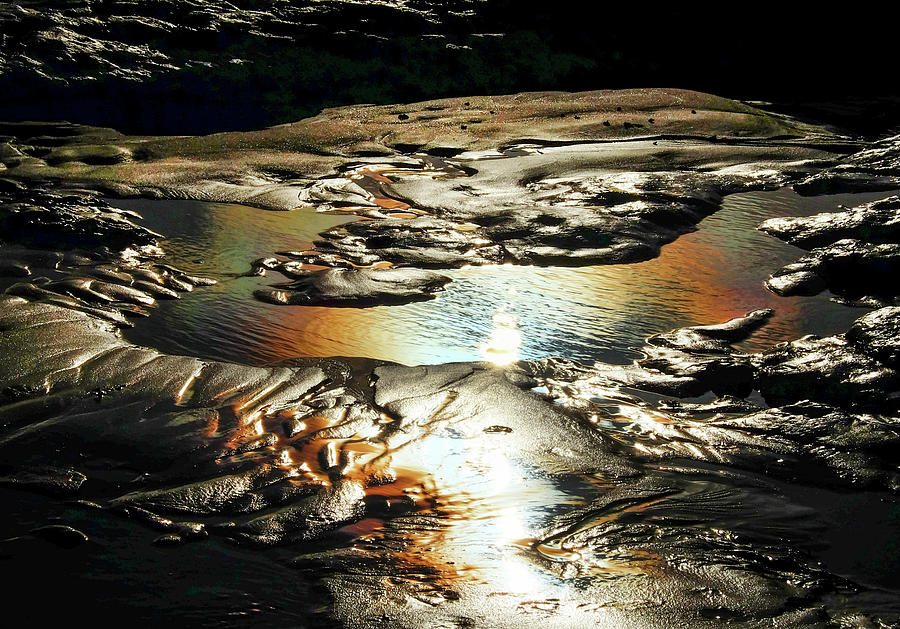 Nature Photograph - Sand and rock pool with rainbow colors from the sun reflecting i by Gill Copeland