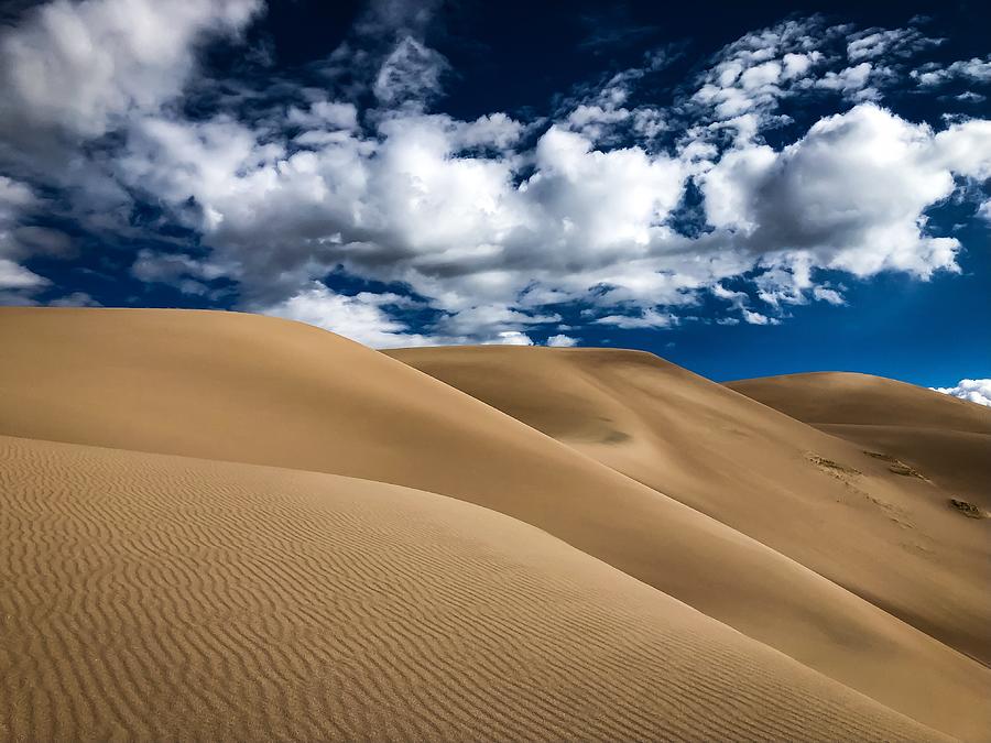 Sand Dunes Under A Blue Sky Photograph by Kevin Schwalbe