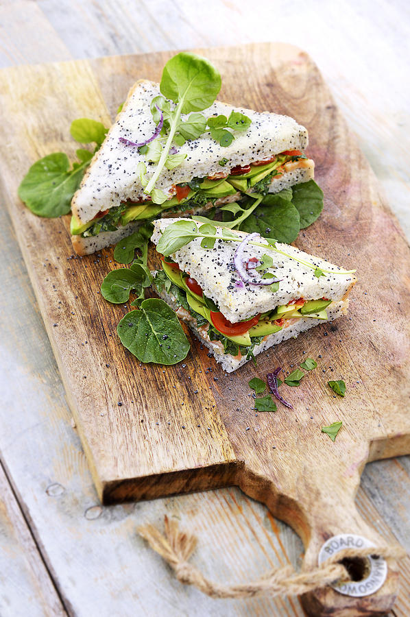 Sandwich With Watercress, Avocado, Salmon And Tomatoes Photograph by Keroudan