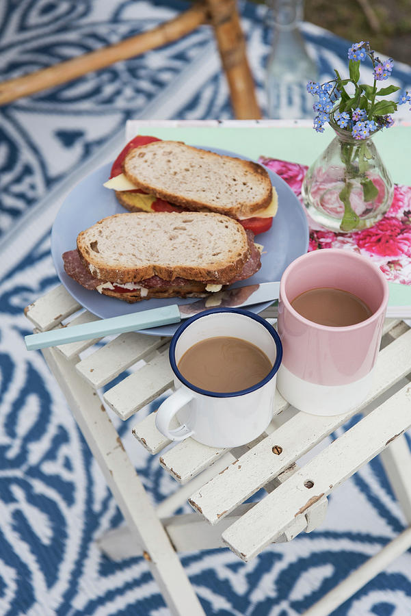 Sandwiches And Coffee Cups On Folding Table Outside Photograph by Jelena Filipinski
