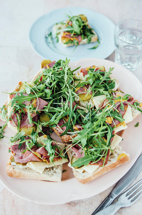 Sandwiches With Pastrami, Cheese And Rocket Photograph by Nick Sida
