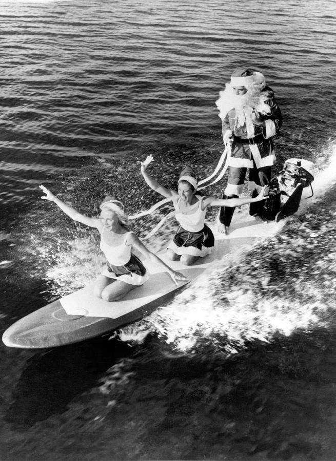 Santa Claus Surfing In Florida In The Photograph by Keystone-france