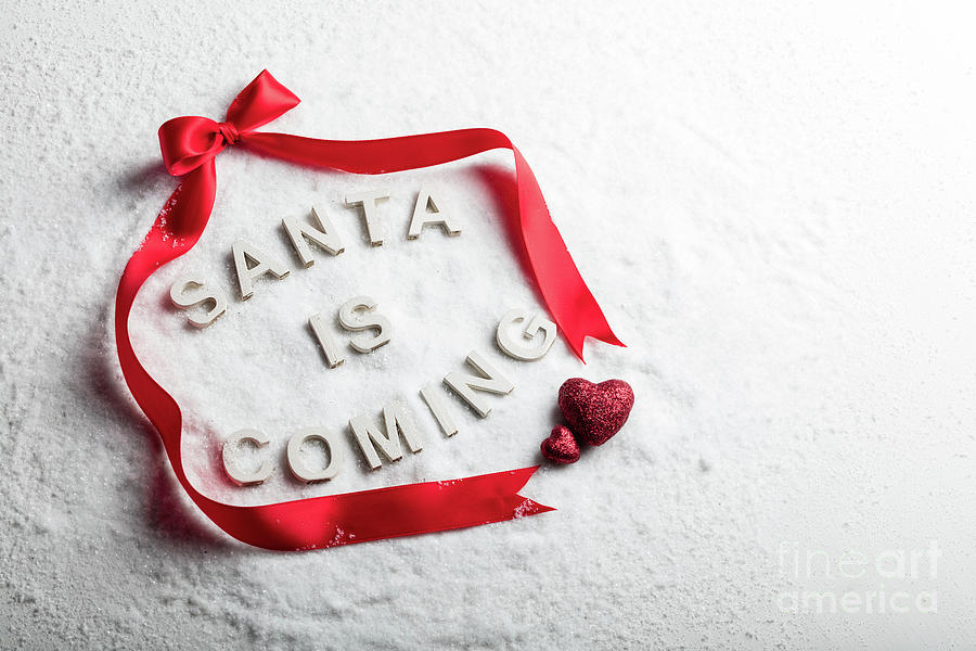 Christmas Photograph - SANTA IS COMING text and red ribbon by Michal Bednarek