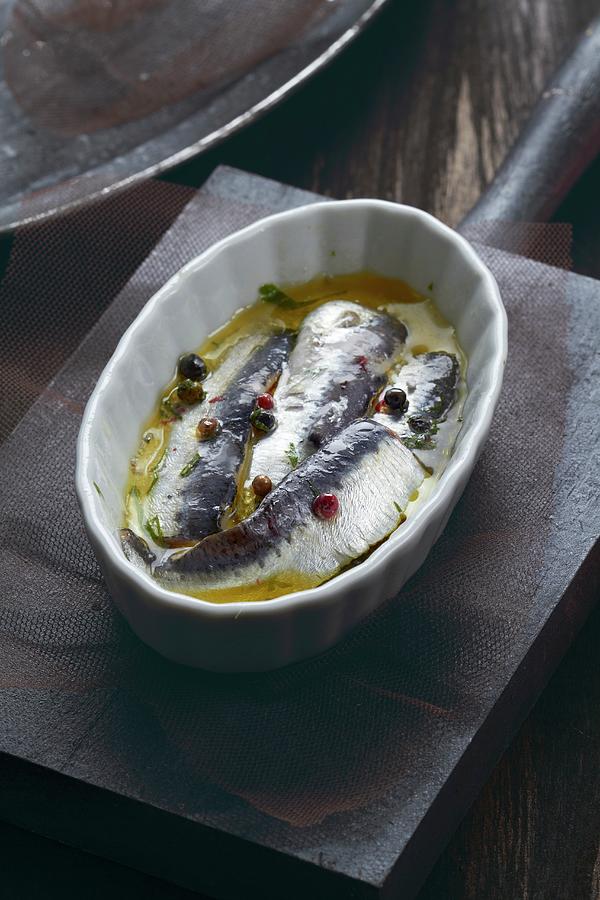 Sardines In Olive Oil With Peppercorns Photograph by Miriam Rapado