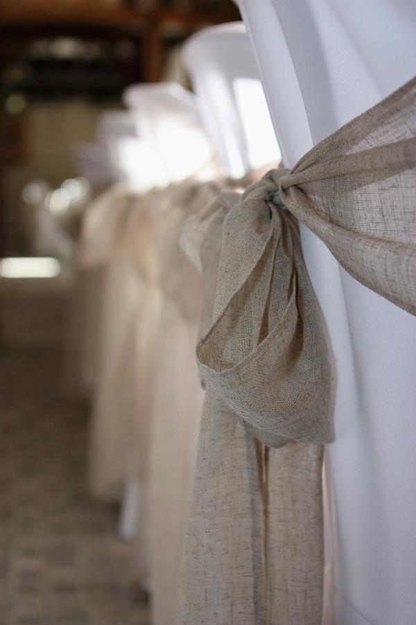 Sashes Tied With Bows On White, Loose-covered Chairs Photograph by Zara Daly