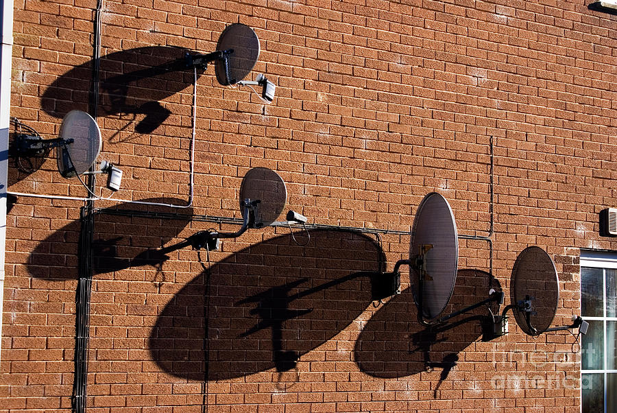 Satellite Dishes On A Wall Photograph by Mark Williamson/science Photo Library
