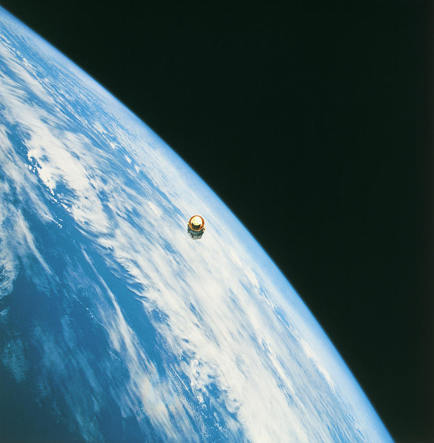 Satellite In Orbit Around The Earth Photograph by Stockbyte