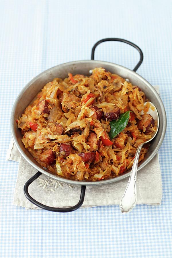 Sauerkraut And Cabbage Braised With Sausage, Bacon And Mushrooms bigos Photograph by Rua Castilho