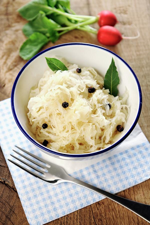 Sauerkraut With Bay Leaves And Juniper Berries Photograph by Peters, Ina