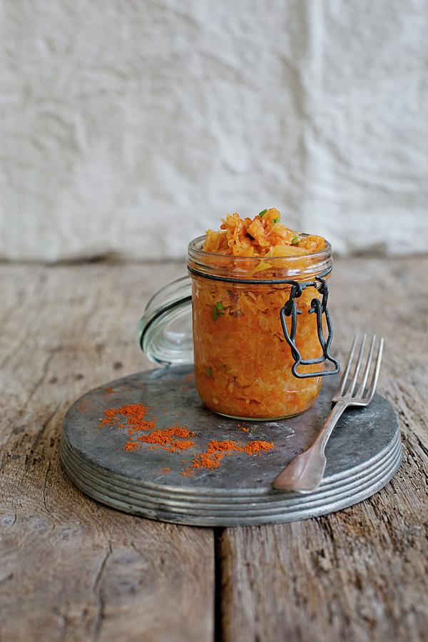 Sauerkraut With Peppers In A Glass Jar Photograph by Tina Engel