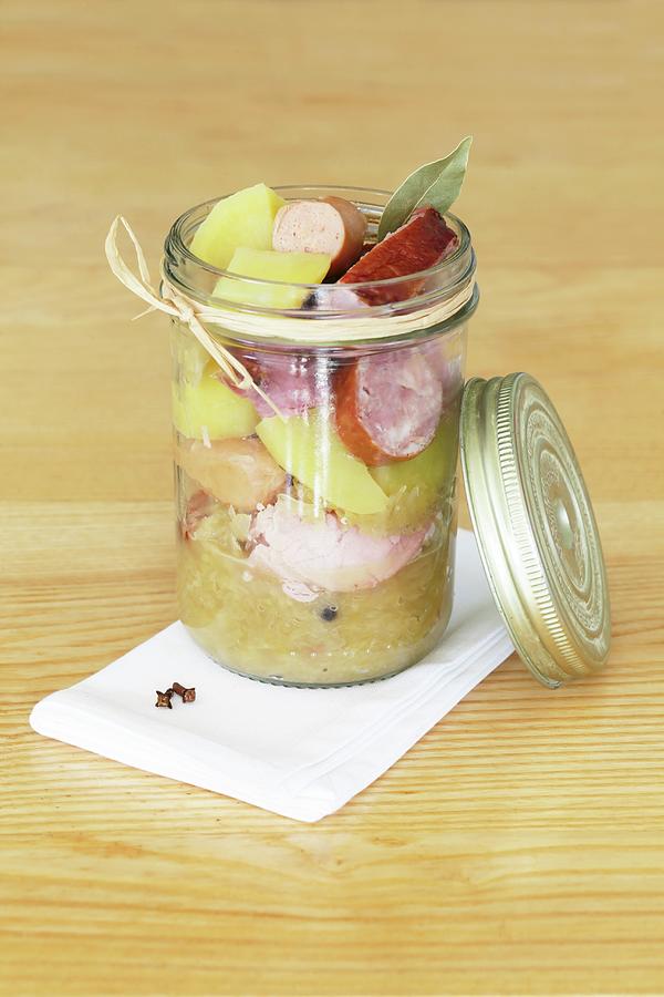 Sauerkraut With Sausage And Potatoes In A Glass Jar Photograph by Lydie Besancon