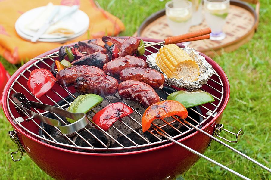 Sausages And Vegetables On A Charcoal Grill Photograph by Tomasz Jakusz