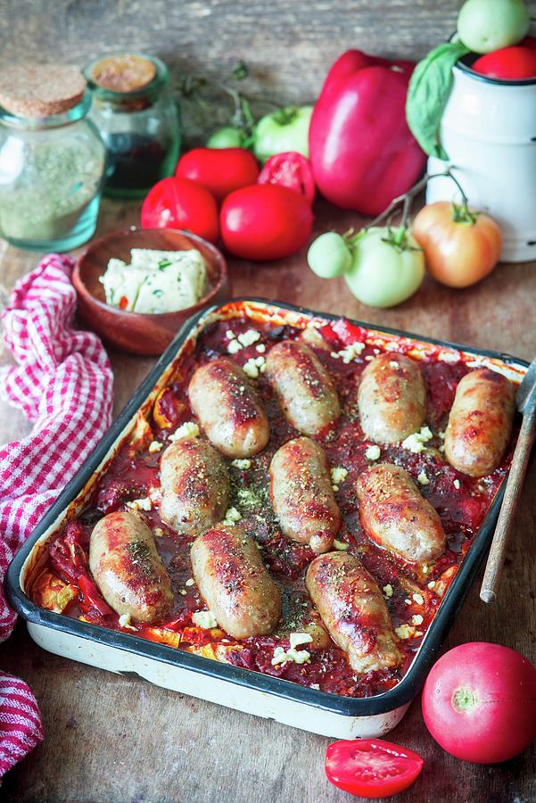 Sausages Baked With Vegetables And Tomato Sauce Photograph by Irina Meliukh