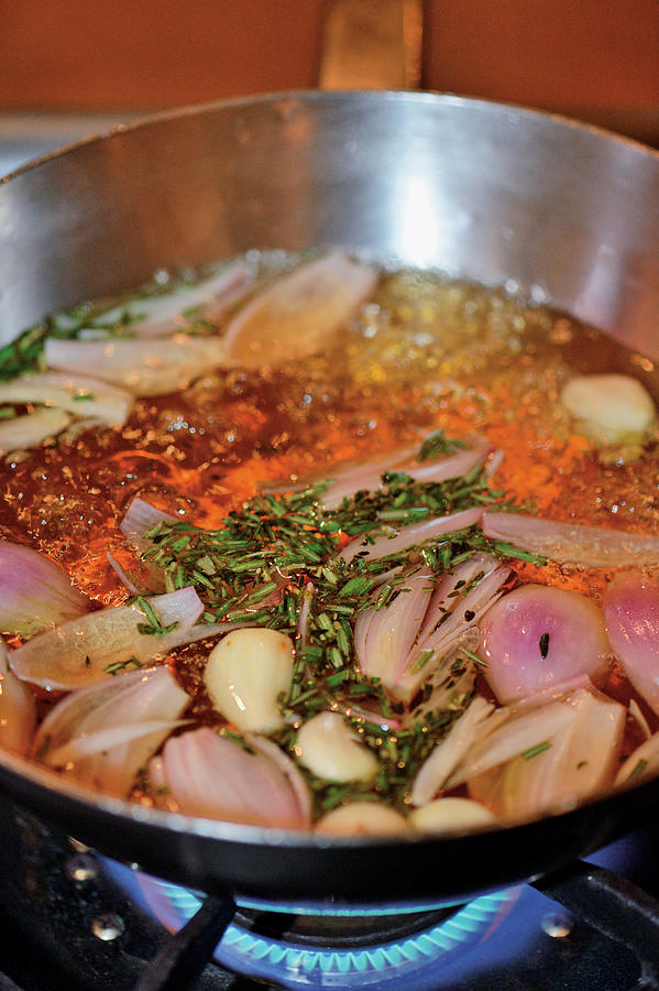 Sausages Being Made: Shallots And Garlic Being Boiled In Stock Photograph by Torri Tre